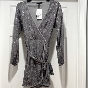 Forever 21 Sequined mock wrap belted silver mini dress.
